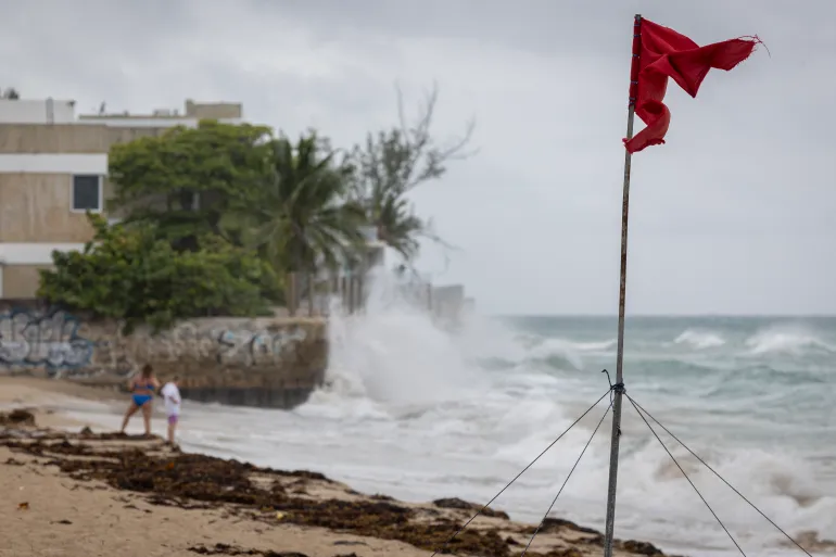Erin Downgraded to Category 3 Hurricane